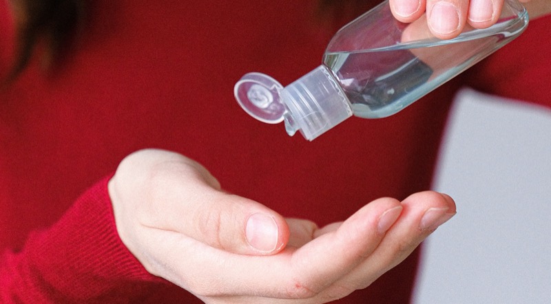 Applying hand sanitiser